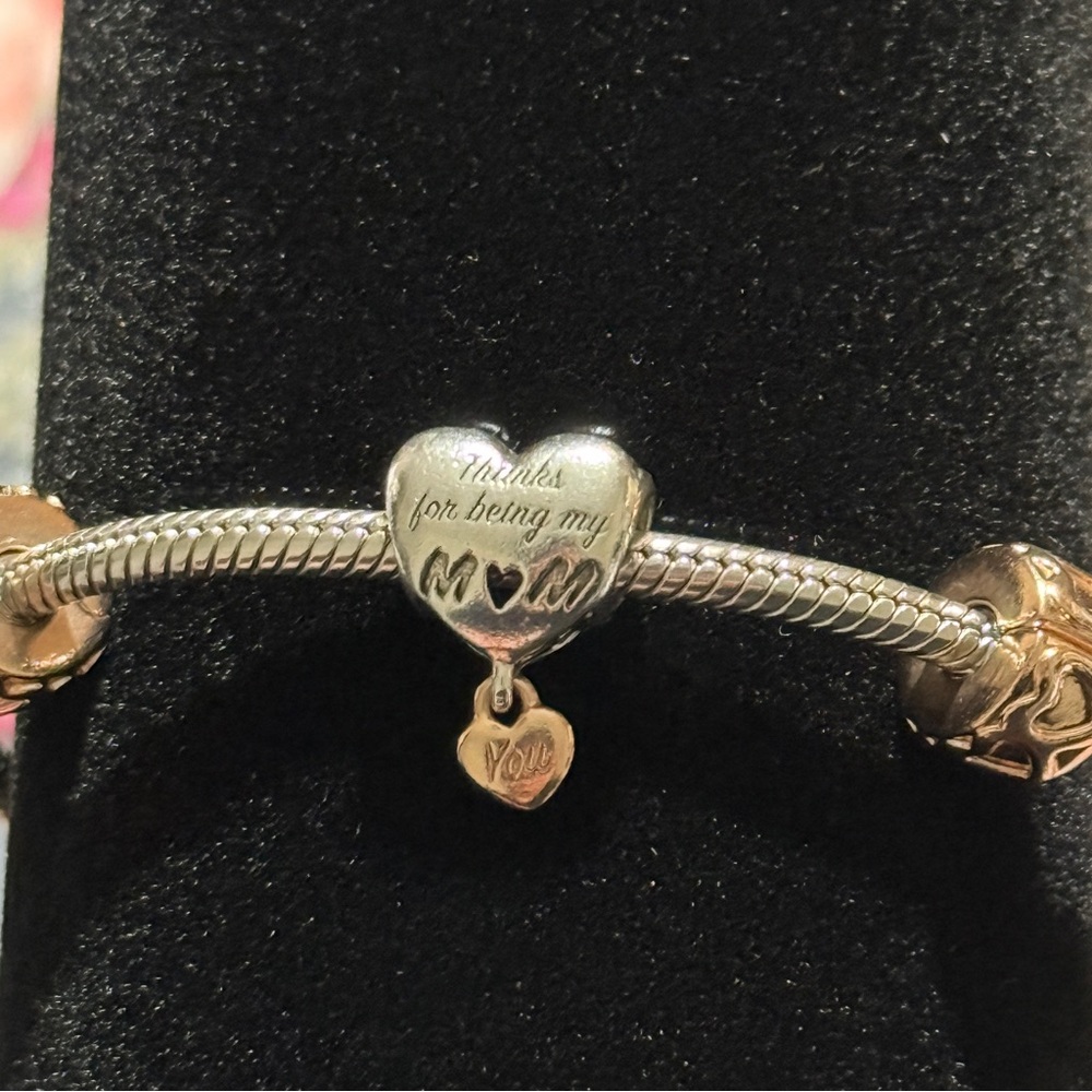 Authentic Pandora Toggle Bracelet with 1Charm and 2 spacers.